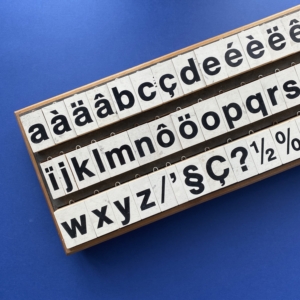 Complete set of large Helvetica Neoprint stamps in a sturdy wood box, 1980s